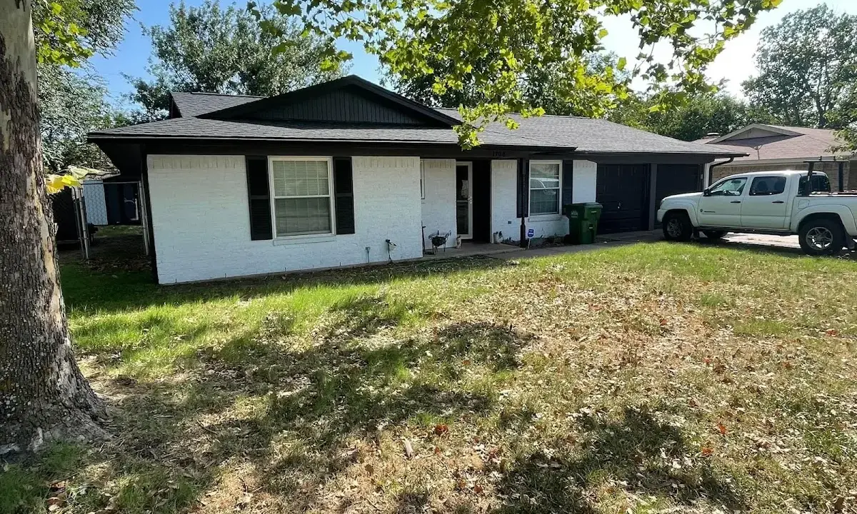Professional roofing crew working on a residential roof in Lehi